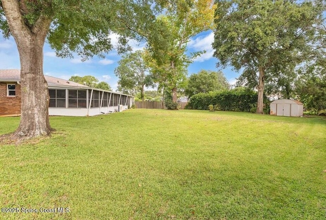 631 Dundee Cir, Melbourne, FL 32904 - view of yard featuring a storage shed and a sunroom