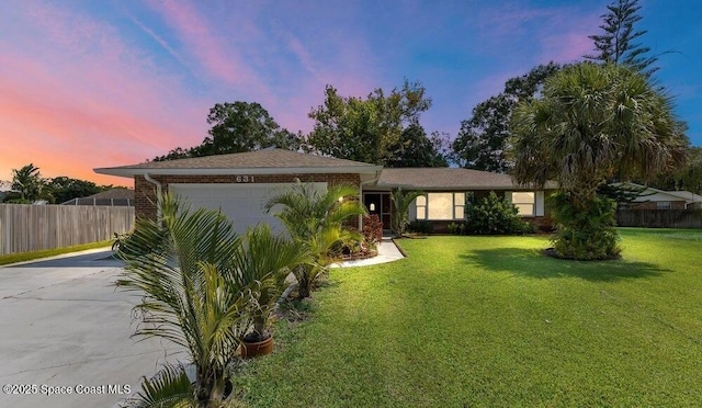 631 Dundee Cir, Melbourne, FL 32904 - single story home with concrete driveway and an attached garage