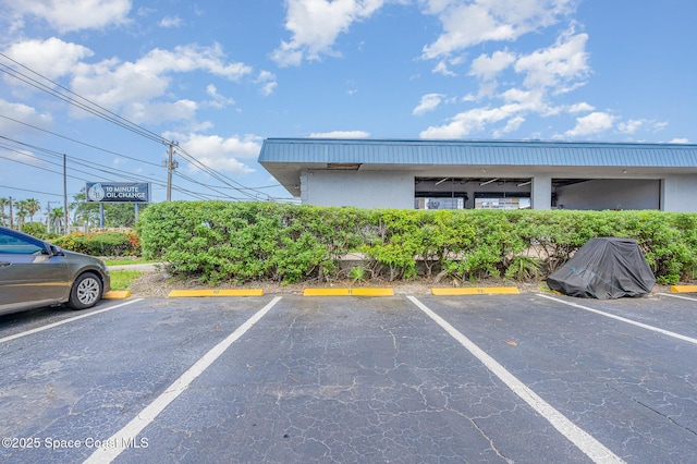 390 W Cocoa Beach Cswy Unit 11-2, Cocoa Beach, FL 32931 - view of uncovered parking lot