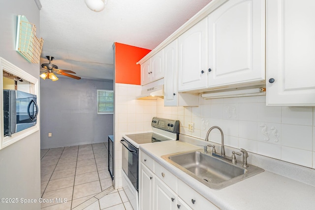 390 W Cocoa Beach Cswy Unit 11-2, Cocoa Beach, FL 32931 - kitchen featuring electric range, under cabinet range hood, decorative backsplash, and light countertops