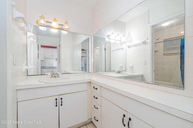 390 W Cocoa Beach Cswy Unit 11-2, Cocoa Beach, FL 32931 - bathroom featuring double vanity and a tile shower