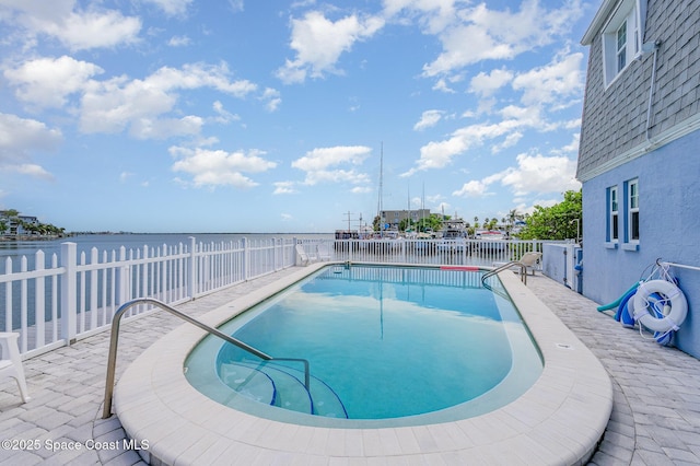 390 W Cocoa Beach Cswy Unit 11-2, Cocoa Beach, FL 32931 - community pool featuring a fenced backyard and a water view