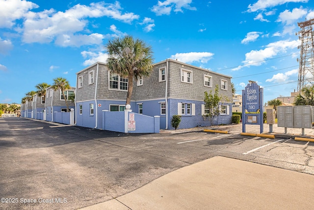 390 W Cocoa Beach Cswy Unit 11-2, Cocoa Beach, FL 32931 - view of property with uncovered parking