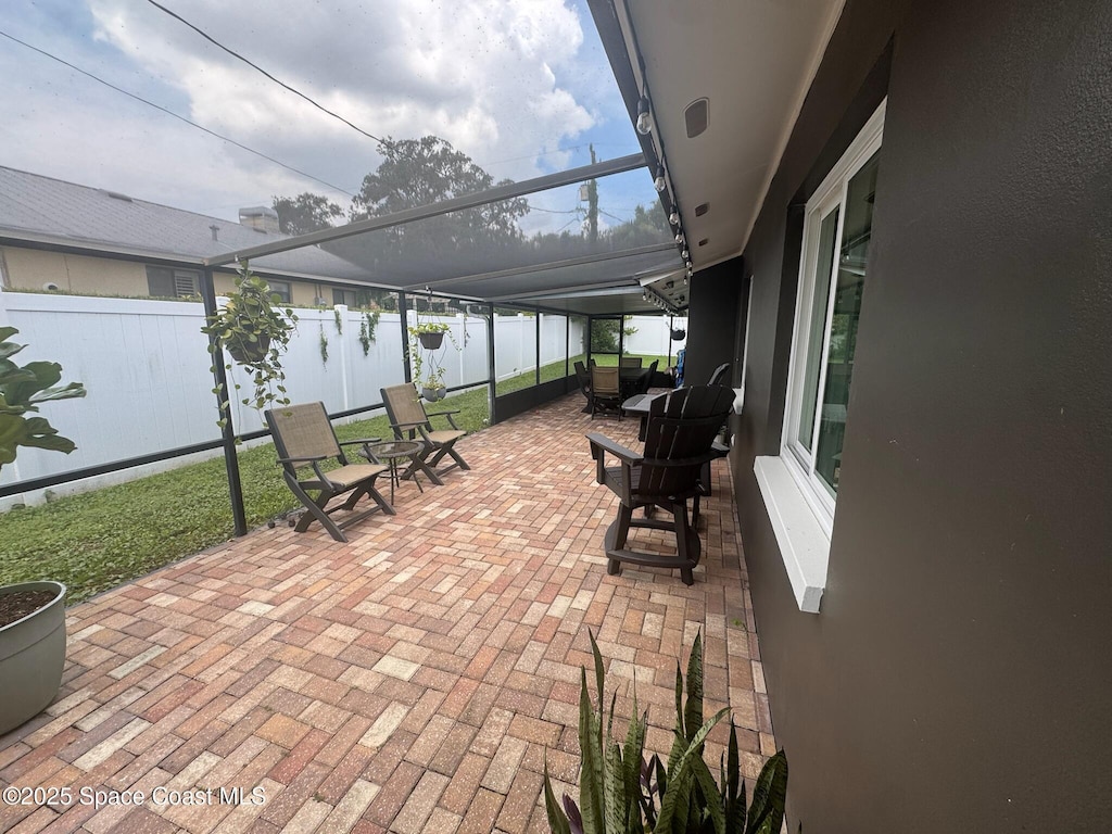 131 Briarwood Ln, Cocoa, FL 32926 - fenced backyard featuring a patio area and a lanai