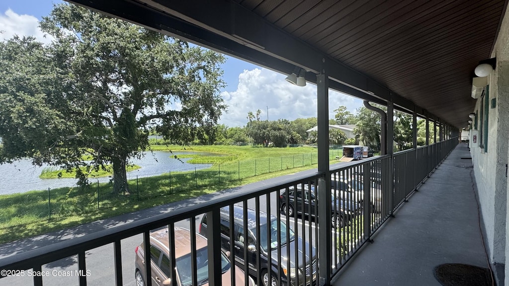 455 Catamaran Dr Unit 48, Merritt Island, FL 32952 - balcony featuring a water view and view of wooded area