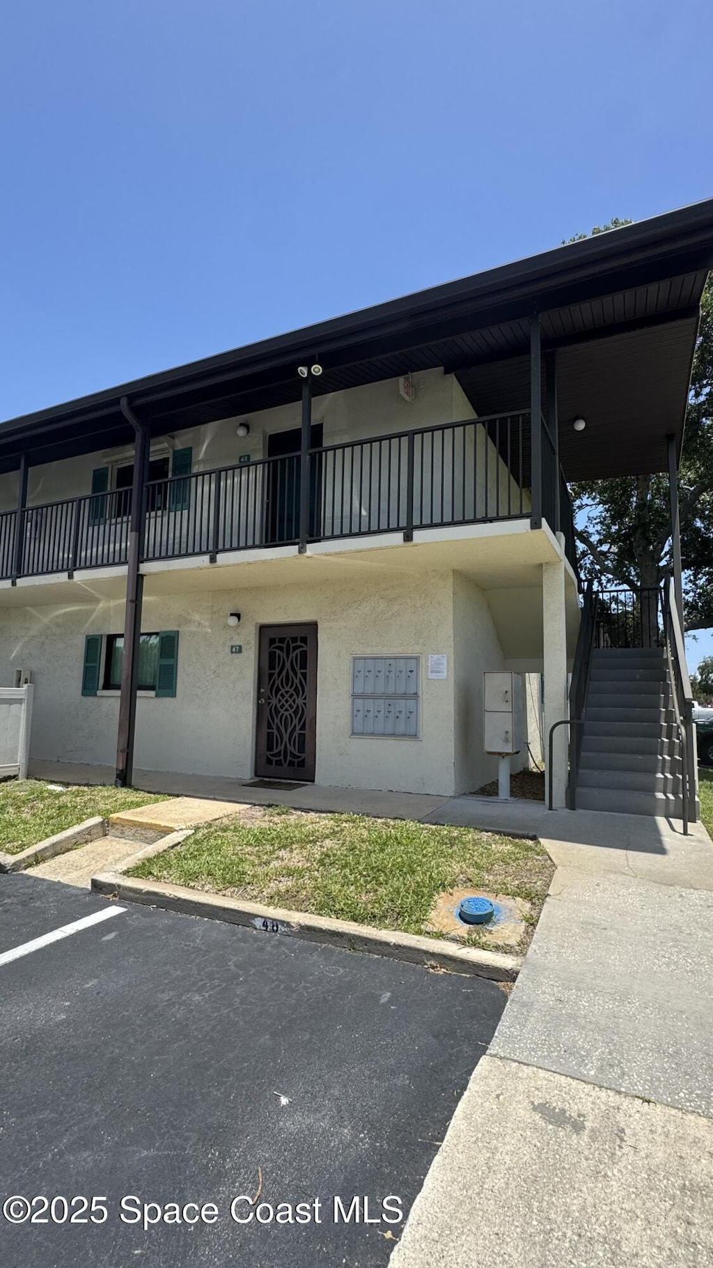 455 Catamaran Dr Unit 48, Merritt Island, FL 32952 - view of building exterior with stairs