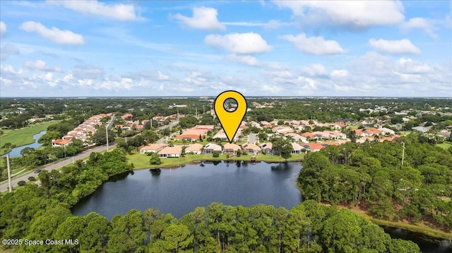 442 Carmel Dr, Melbourne, FL 32940 - aerial perspective of suburban area with a nearby body of water and a tree filled landscape