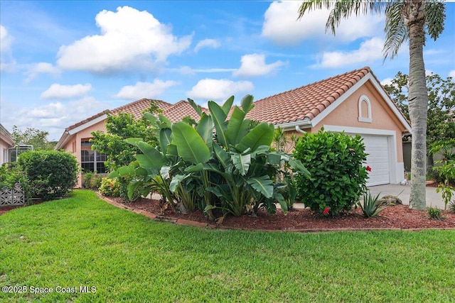 442 Carmel Dr, Melbourne, FL 32940 - view of front facade with a front lawn, a tiled roof, stucco siding, and an attached garage