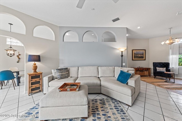 442 Carmel Dr, Melbourne, FL 32940 - living room featuring light tile patterned floors, a chandelier, recessed lighting, and a ceiling fan
