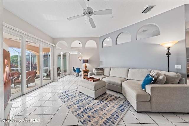 442 Carmel Dr, Melbourne, FL 32940 - living area with light tile patterned floors and ceiling fan