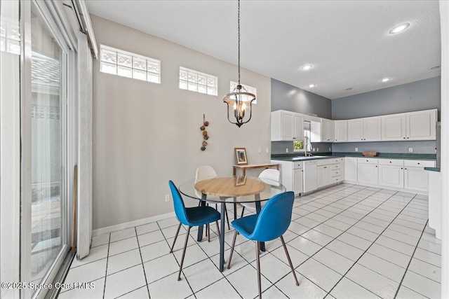 442 Carmel Dr, Melbourne, FL 32940 - dining room with light tile patterned floors, a chandelier, and recessed lighting