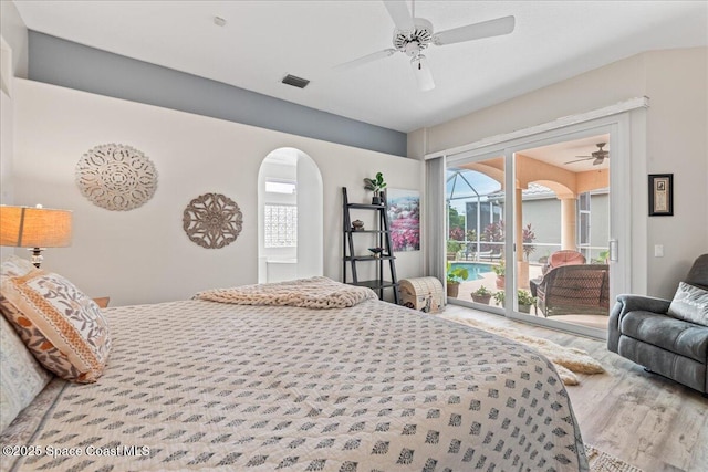 442 Carmel Dr, Melbourne, FL 32940 - bedroom with access to exterior, wood finished floors, and a ceiling fan