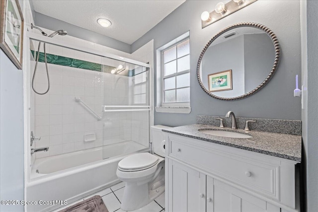442 Carmel Dr, Melbourne, FL 32940 - bathroom featuring vanity, enclosed tub / shower combo, tile patterned flooring, and a textured ceiling