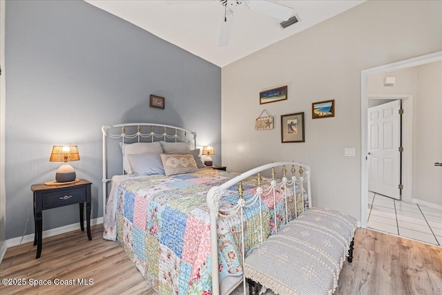 442 Carmel Dr, Melbourne, FL 32940 - bedroom with wood finished floors, lofted ceiling, and a ceiling fan