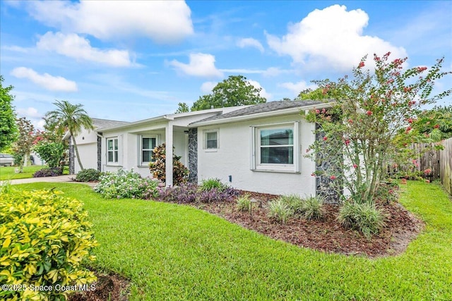 822 Berkshire Dr, Rockledge, FL 32955 - view of front of house with stucco siding, a garage, and driveway