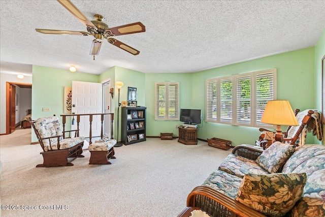 822 Berkshire Dr, Rockledge, FL 32955 - carpeted living room with a ceiling fan and a textured ceiling