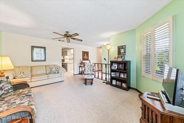 822 Berkshire Dr, Rockledge, FL 32955 - living area featuring carpet, a textured ceiling, and a ceiling fan