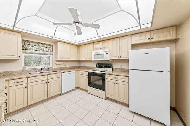 822 Berkshire Dr, Rockledge, FL 32955 - kitchen with white appliances, cream cabinetry, light countertops, ceiling fan, and light tile patterned floors