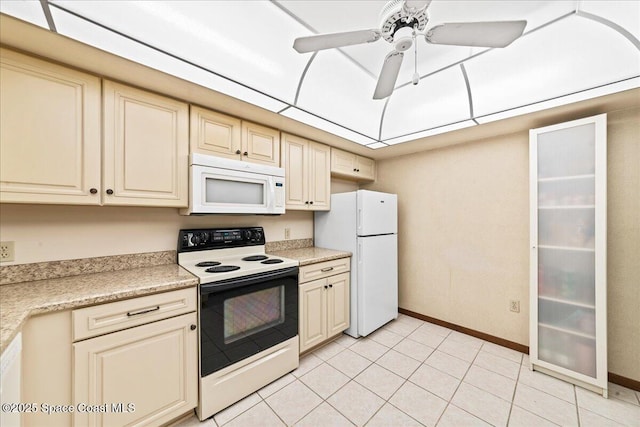 822 Berkshire Dr, Rockledge, FL 32955 - kitchen with cream cabinets, white appliances, a ceiling fan, and light tile patterned floors