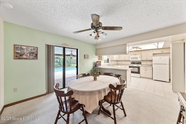 822 Berkshire Dr, Rockledge, FL 32955 - dining space featuring light carpet, a ceiling fan, and a textured ceiling