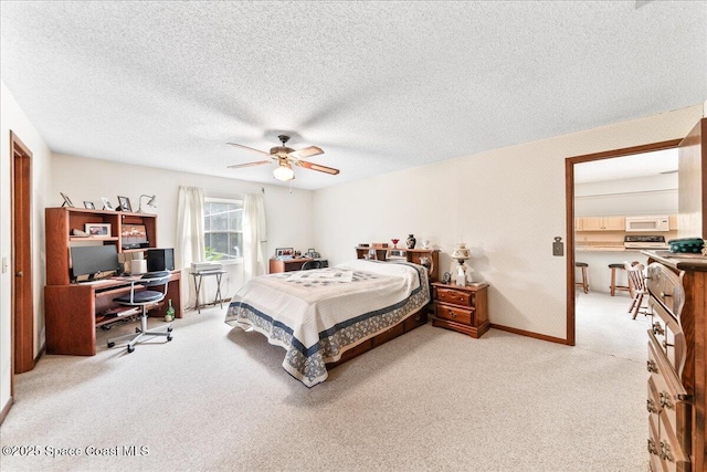 822 Berkshire Dr, Rockledge, FL 32955 - bedroom featuring a desk, light carpet, a textured ceiling, and ceiling fan