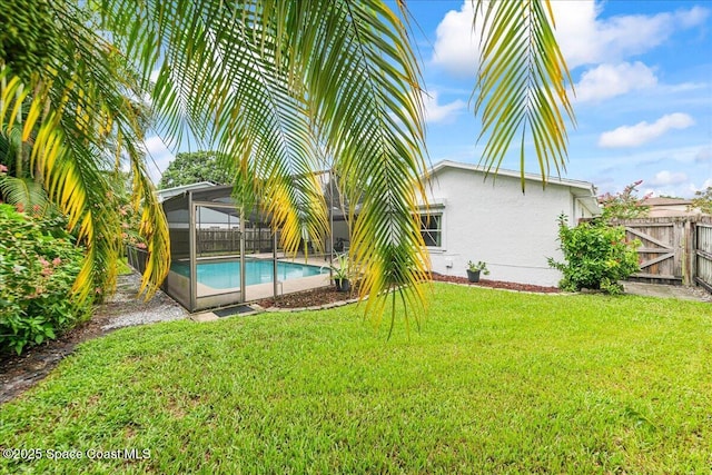 822 Berkshire Dr, Rockledge, FL 32955 - fenced backyard featuring a gate and glass enclosure
