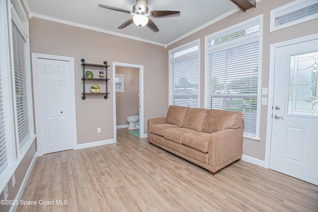110 Windsong Way, Titusville, FL 32780 - living area with light wood-type flooring, a ceiling fan, and crown molding