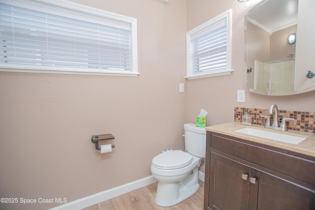 110 Windsong Way, Titusville, FL 32780 - full bath with wood finished floors, vanity, backsplash, and a shower