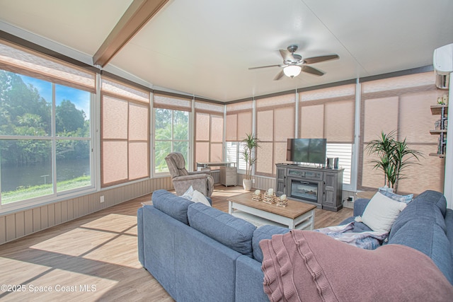 110 Windsong Way, Titusville, FL 32780 - sunroom featuring an outdoor hangout area, ceiling fan, wood finished floors, and a deck with water view