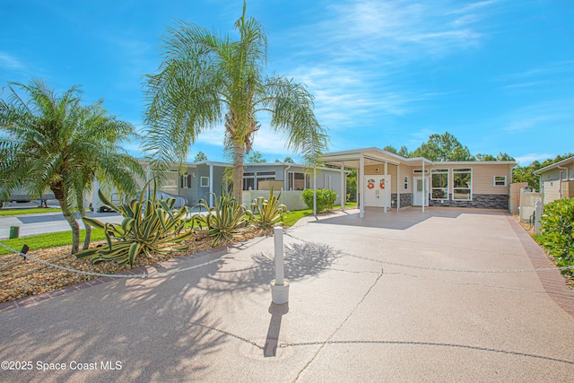 110 Windsong Way, Titusville, FL 32780 - view of front of house with driveway and an attached carport