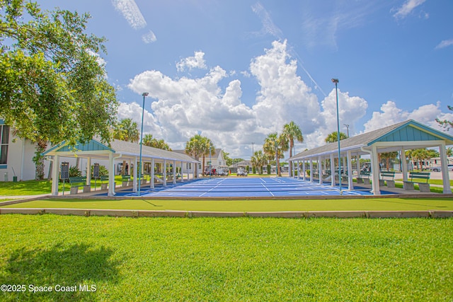 110 Windsong Way, Titusville, FL 32780 - view of community with a yard and shuffleboard