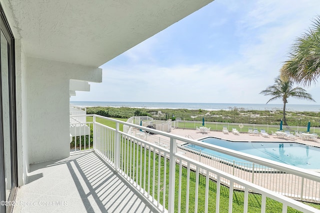 2101 S Atlantic Ave Unit 205, Cocoa Beach, FL 32931 - balcony with view of pool and a water view