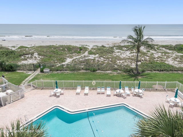 2101 S Atlantic Ave Unit 205, Cocoa Beach, FL 32931 - community pool featuring view of water and beach and a patio area