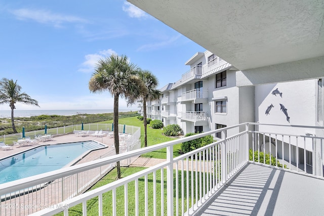 2101 S Atlantic Ave Unit 205, Cocoa Beach, FL 32931 - balcony with view of pool and a water view