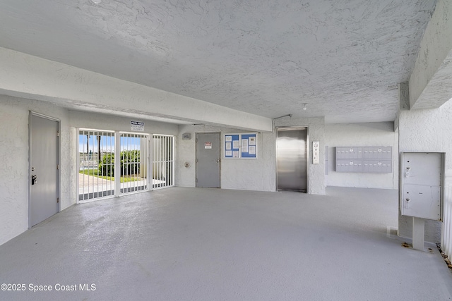 2101 S Atlantic Ave Unit 205, Cocoa Beach, FL 32931 - garage with elevator and a textured wall
