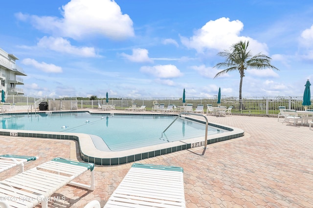 2101 S Atlantic Ave Unit 205, Cocoa Beach, FL 32931 - community pool with a patio area