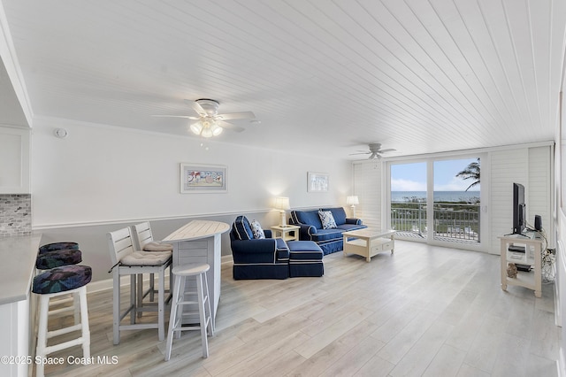 2101 S Atlantic Ave Unit 205, Cocoa Beach, FL 32931 - living room featuring ceiling fan, wooden ceiling, and light wood-style flooring