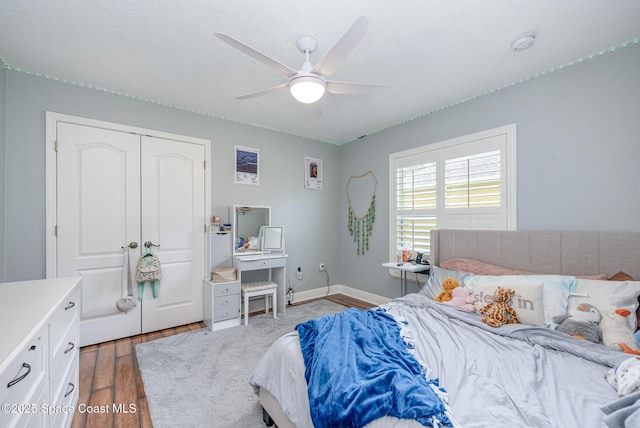 4333 Browning Ln, Rockledge, FL 32955 - bedroom with wood finished floors, ceiling fan, and a closet