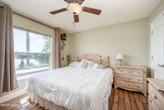 4333 Browning Ln, Rockledge, FL 32955 - bedroom with wood finished floors, multiple windows, and ceiling fan