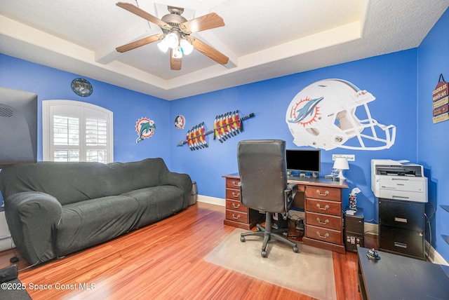 4333 Browning Ln, Rockledge, FL 32955 - home office with wood finished floors, a ceiling fan, and beamed ceiling
