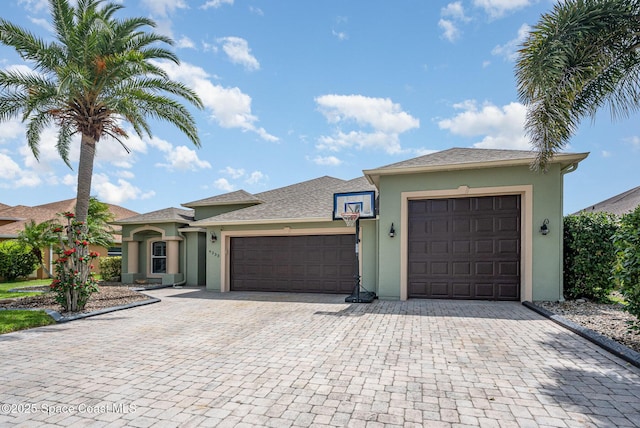 4333 Browning Ln, Rockledge, FL 32955 - view of front of property with stucco siding, a garage, and decorative driveway