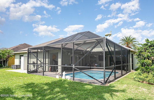 4333 Browning Ln, Rockledge, FL 32955 - back of property featuring a patio, an outdoor pool, a yard, and glass enclosure