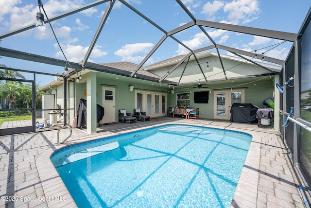 4333 Browning Ln, Rockledge, FL 32955 - outdoor pool with french doors, a patio area, ceiling fan, and glass enclosure