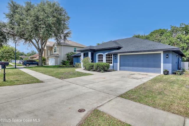 2559 Christopher Dr, Titusville, FL 32780 - ranch-style home featuring stucco siding, roof with shingles, concrete driveway, and a front yard