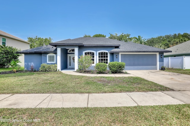 2559 Christopher Dr, Titusville, FL 32780 - ranch-style house with stucco siding, an attached garage, driveway, and a shingled roof