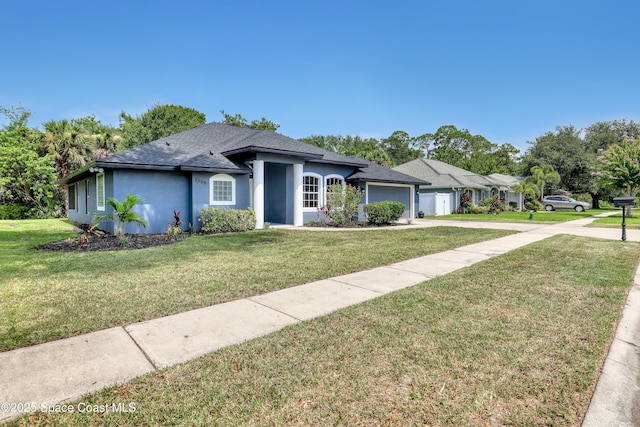2559 Christopher Dr, Titusville, FL 32780 - ranch-style home featuring a garage, a front lawn, stucco siding, concrete driveway, and a shingled roof