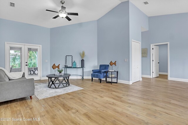 2559 Christopher Dr, Titusville, FL 32780 - living area with ceiling fan, light wood-style floors, french doors, and high vaulted ceiling