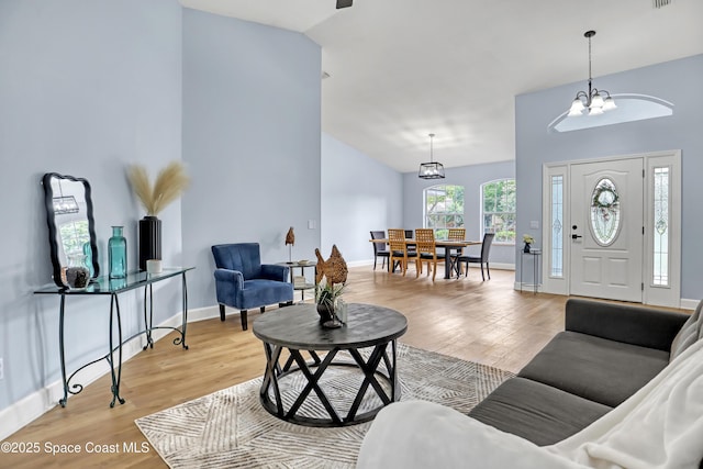 2559 Christopher Dr, Titusville, FL 32780 - living room with light wood-type flooring and high vaulted ceiling