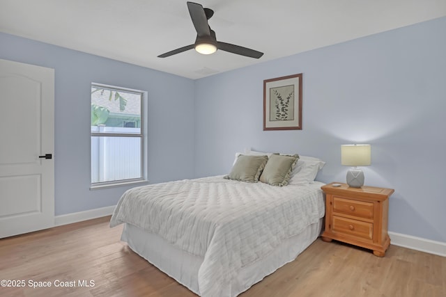 2559 Christopher Dr, Titusville, FL 32780 - bedroom featuring light wood-style flooring and a ceiling fan