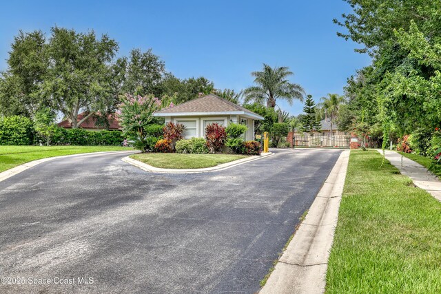 2559 Christopher Dr, Titusville, FL 32780 - view of front of home featuring a gate